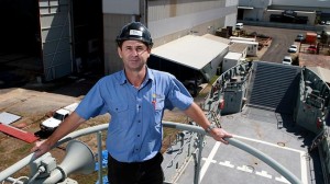 EYE ON THE PRIZE BSE Maritime Solutions has joined Norship Marine and other firms to tender for a contract involving the construction of 21 patrol boats worth $594 million plus providing support, maintenance and personnel over 30 years, worth another $1.38 billion. Brian Keller of BSE Slipways is pictured with a navy landing craft. PICTURE JUSTIN BRIERTY