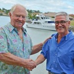 Gold Coast International Marine Expo president Stephen Milne (right) hands the reigns over to Gold Coast boating and business leader Patrick Gay AM
