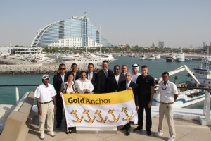 1. John Hogan, Superior, (centre) presenting Jumeirah Beach Hotel Marina management and staff with their 5 Gold Anchor accreditation